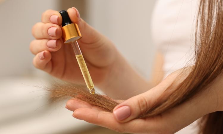 applying natural oil for hair growth